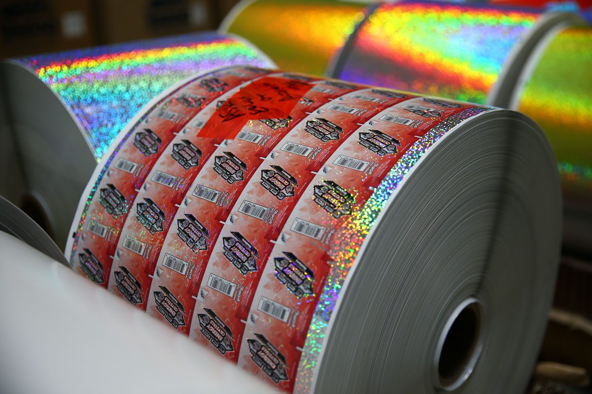rolls of pressure sensitive packaging labels with glitter varnish
